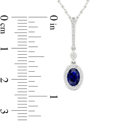 Oval Blue Sapphire and 0.07 CT. T.W. Natural Diamond Frame Drop Pendant in 10K White Gold