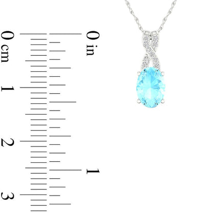 Oval Aquamarine and 0.05 CT. T.W. Natural Diamond X" Drop Pendant in 10K White Gold"