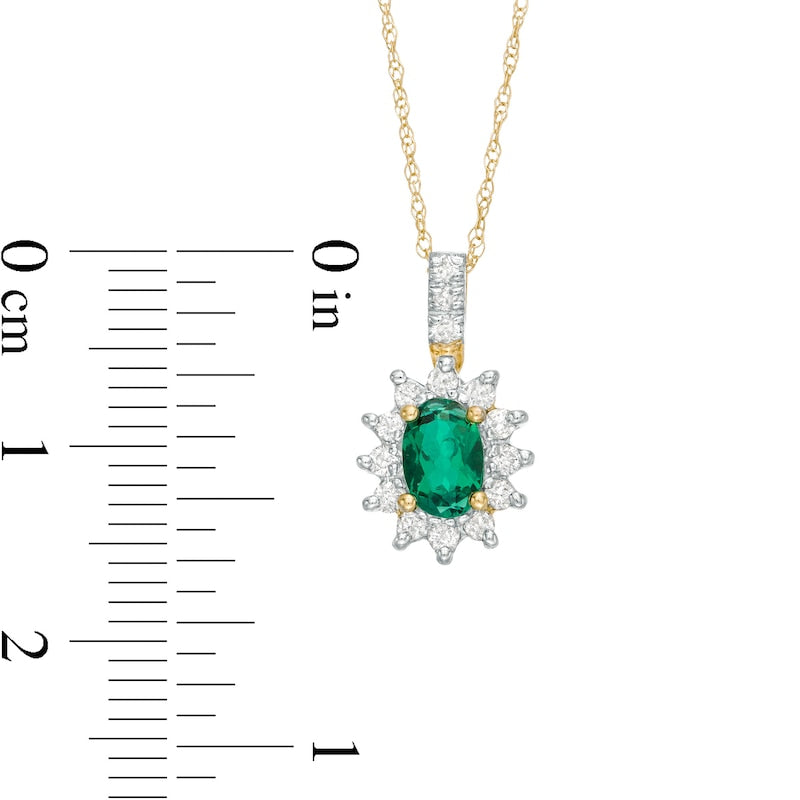 Oval Lab-Created Emerald and 0.2 CT. T.W. Diamond Starburst Frame Pendant in 10K Yellow Gold