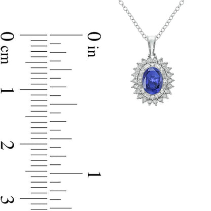 Oval Lab-Created Blue Sapphire and 0.13 CT. T.W. Diamond Starburst Double Frame Drop Pendant in Sterling Silver