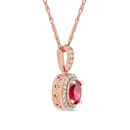 Oval Ruby and 0.05 CT. T.W. Natural Diamond Framed Antique Vintage-Style Drop Pendant in 10K Rose Gold