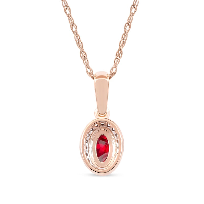 Oval Ruby and 0.05 CT. T.W. Natural Diamond Framed Antique Vintage-Style Drop Pendant in 10K Rose Gold