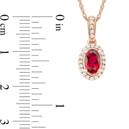 Oval Ruby and 0.05 CT. T.W. Natural Diamond Framed Antique Vintage-Style Drop Pendant in 10K Rose Gold