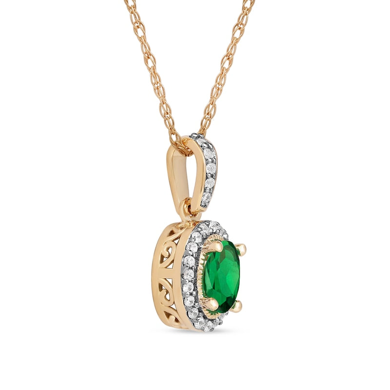 Oval Emerald and 0.05 CT. T.W. Natural Diamond Framed Antique Vintage-Style Drop Pendant in 10K Yellow Gold