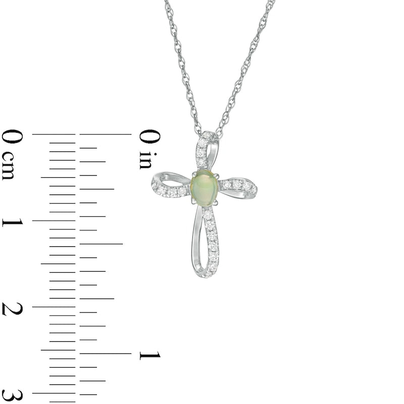Oval Opal and 0.1 CT. T.W. Natural Diamond Pinwheel Cross Pendant in 10K White Gold